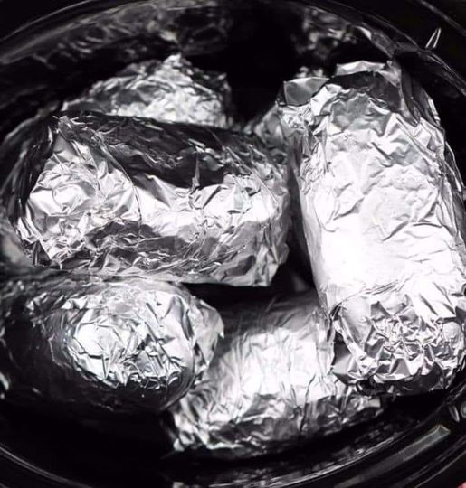 Wrap potatoes in tin foil and put in crock pot.