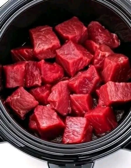 Put raw cubed beef in a slow cooker with these 3 ingredients. You won’t believe how good it tastes