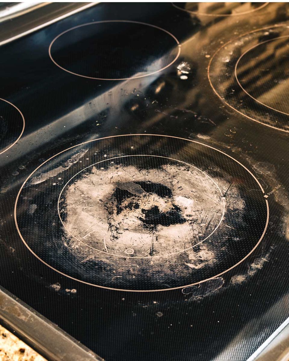 My glass stove top looks gross and may even be damaged. What should I do?