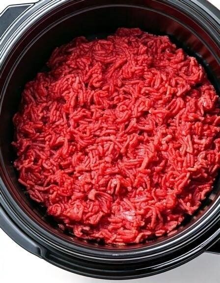 Put raw ground beef in a slow cooker with these 4 ingredients. It’s comfort food perfection..