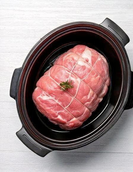 Put raw pork roast in your slow cooker with 4 simple ingredients. You won’t believe how tender and delicious this is.