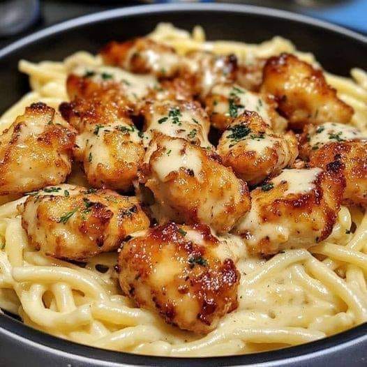 Golden Garlic Chicken Bitesover Creamy ParmesanPasta