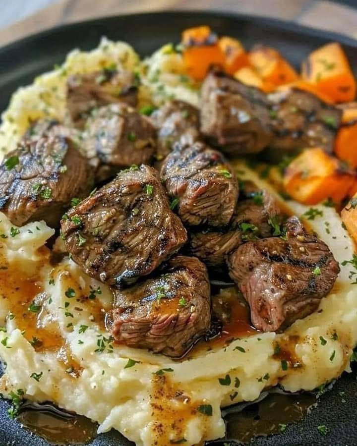 Hearty Seared Beef Tips with Creamy Mashed Potatoes and Roasted Carrots